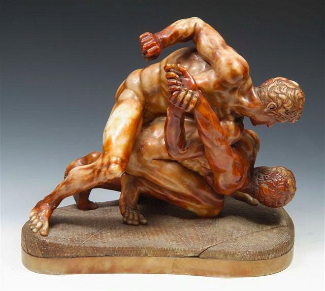 Appraisal: A VICTORIAN ALABASTER GROUP OF WRESTLERS AFTER THE ANTIQUE on