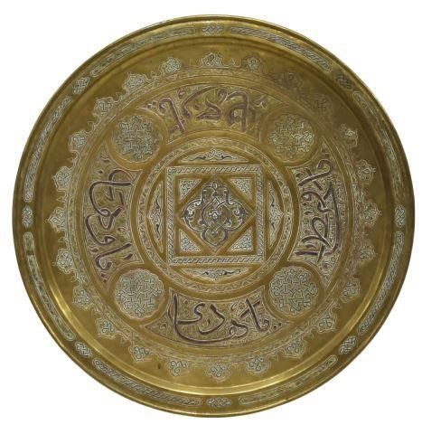 Appraisal: Large Islamic brass wall charger with mixed metal inlays arabesque