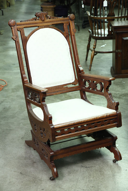 Appraisal: PLATFORM ROCKER Eastlake style rocker with carved and incised decoration