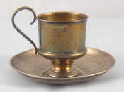 Appraisal: A Russian silver tea glass holder and associated saucer Holder