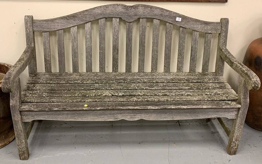 Appraisal: Teak outdoor bench having arched top Teak outdoor bench having