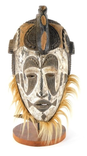 Appraisal: Tribal Art A carved mask on painted white ground with