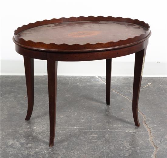 Appraisal: Sale Lot An Oval Low Table having a scalloped gallery