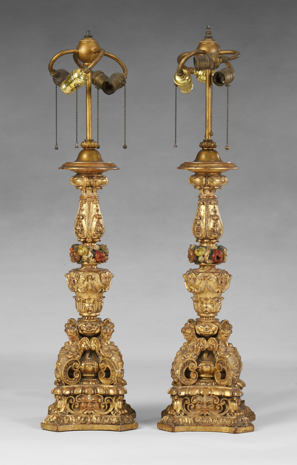 Appraisal: th Century Italian Carved Gilt Lamp Bases Carved cherub faces