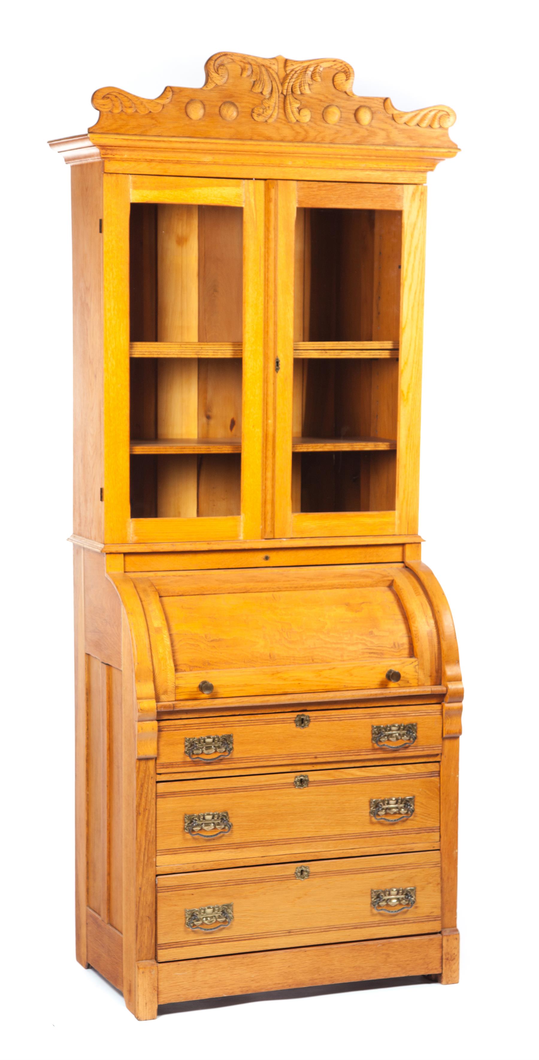 Appraisal: LATE-VICTORIAN TWO-PIECE CYLINDER ROLL SECRETARY BOOKCASE American th quarter- th