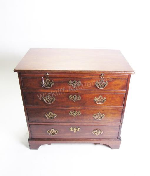 Appraisal: A Chippendale period mahogany bachelor's chest with four graduated drawers