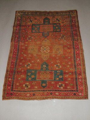 Appraisal: A Turkish rug with cruciform medallions in a brick red