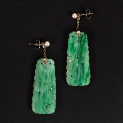 Appraisal: A pair of carved jade ear pendants each tapering panel