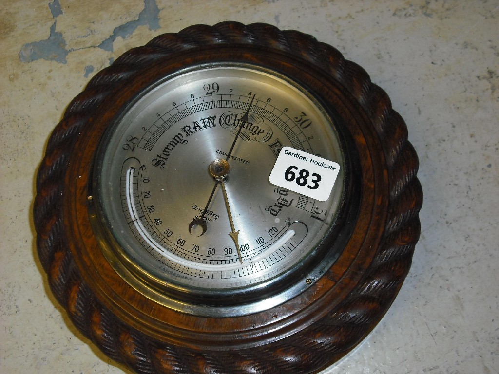 Appraisal: Army Navy Stores circular barometer the silvered dial within an