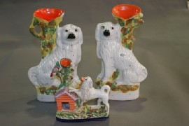 Appraisal: A pair of Staffordshire spaniel spill vases circa together with