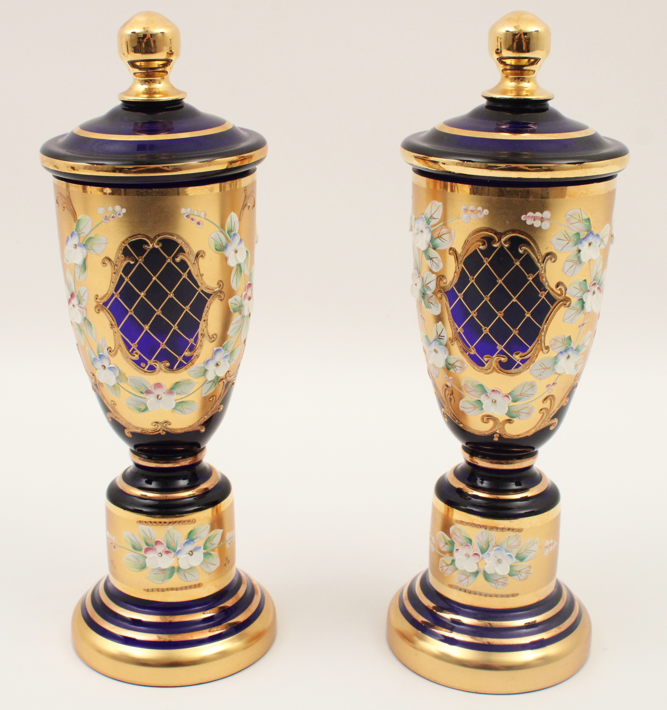 Appraisal: PAIR OF BOHEMIAN CAPPED URNS Pair of Bohemian capped urns