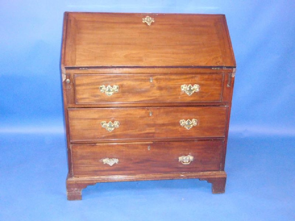 Appraisal: A George III mahogany bureau with fall flap revealing a