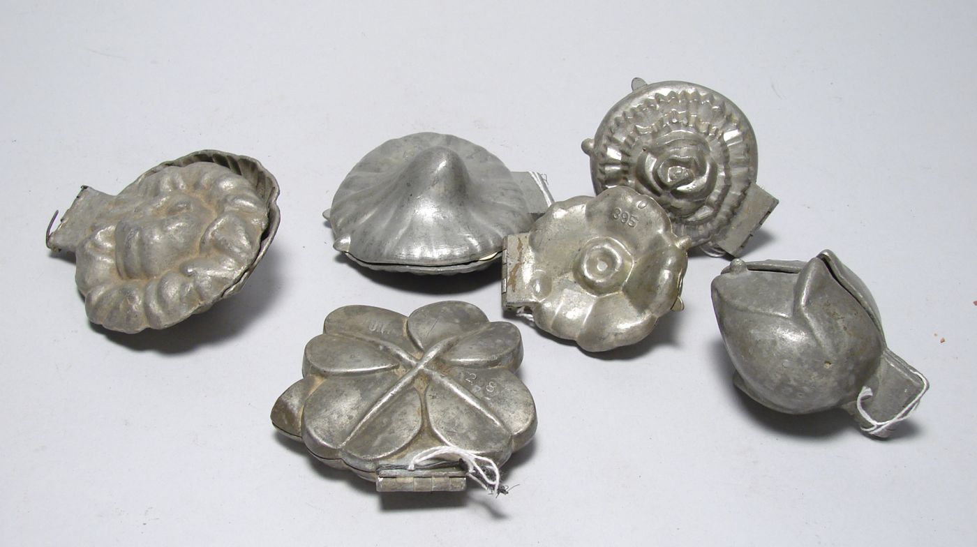 Appraisal: SIX VINTAGE PEWTER ICE CREAM MOLDS A tulip E Co