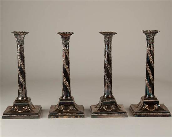 Appraisal: Four Edwardian Ellis-Barker Candlesticks of Birmingham England silverplated with foliate