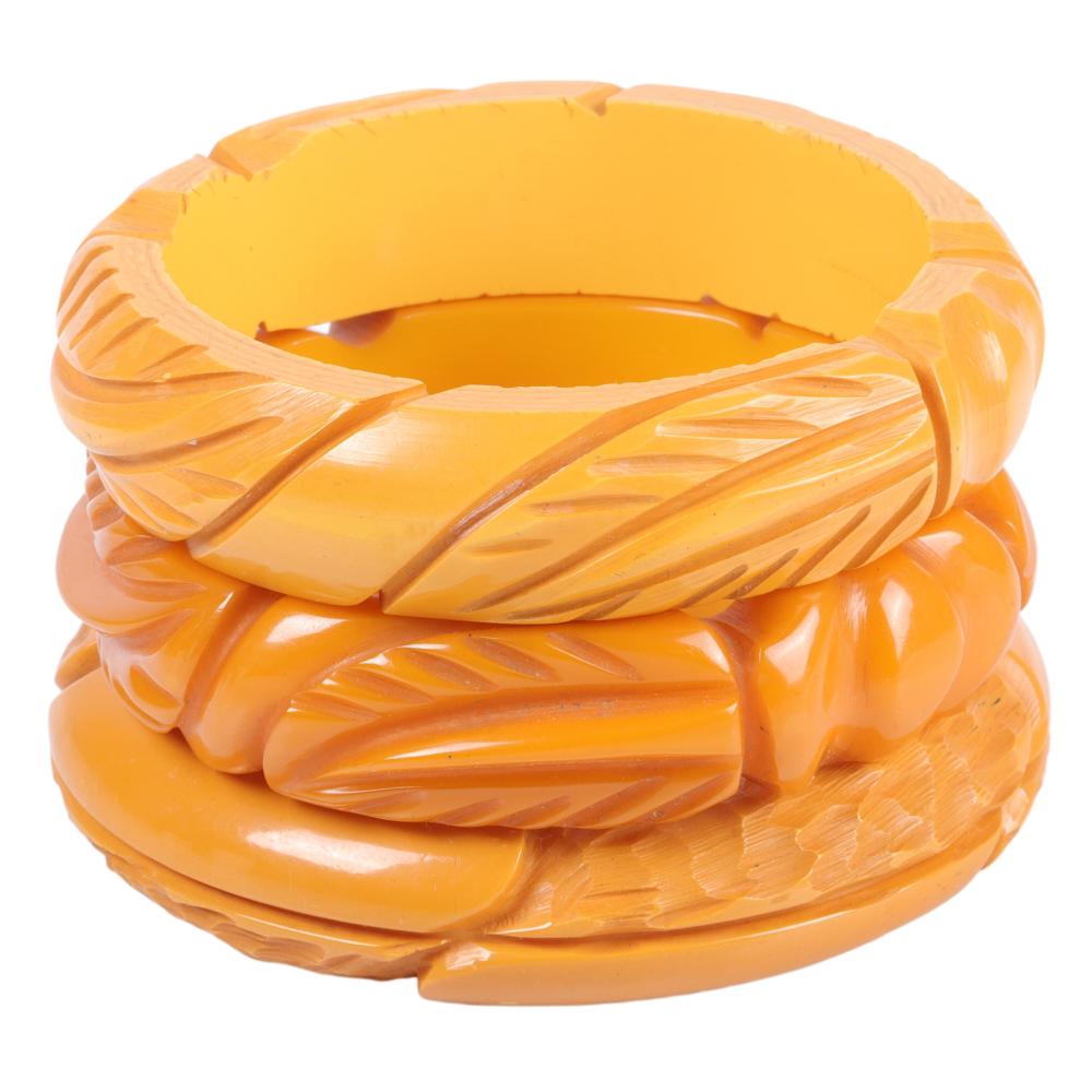 Appraisal: THREE HIGH WALLED BAKELITE BANGLES INNER DIAM X W EACH