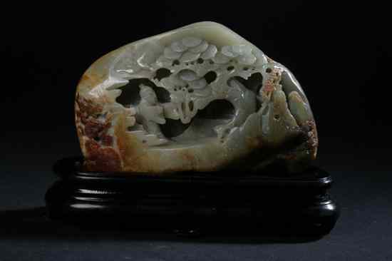 Appraisal: CHINESE CELADON RUSSET AND CHOCOLATE JADE BOULDER Carved to depict