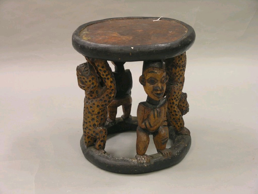 Appraisal: An African tribal stool the whole carved from the solid