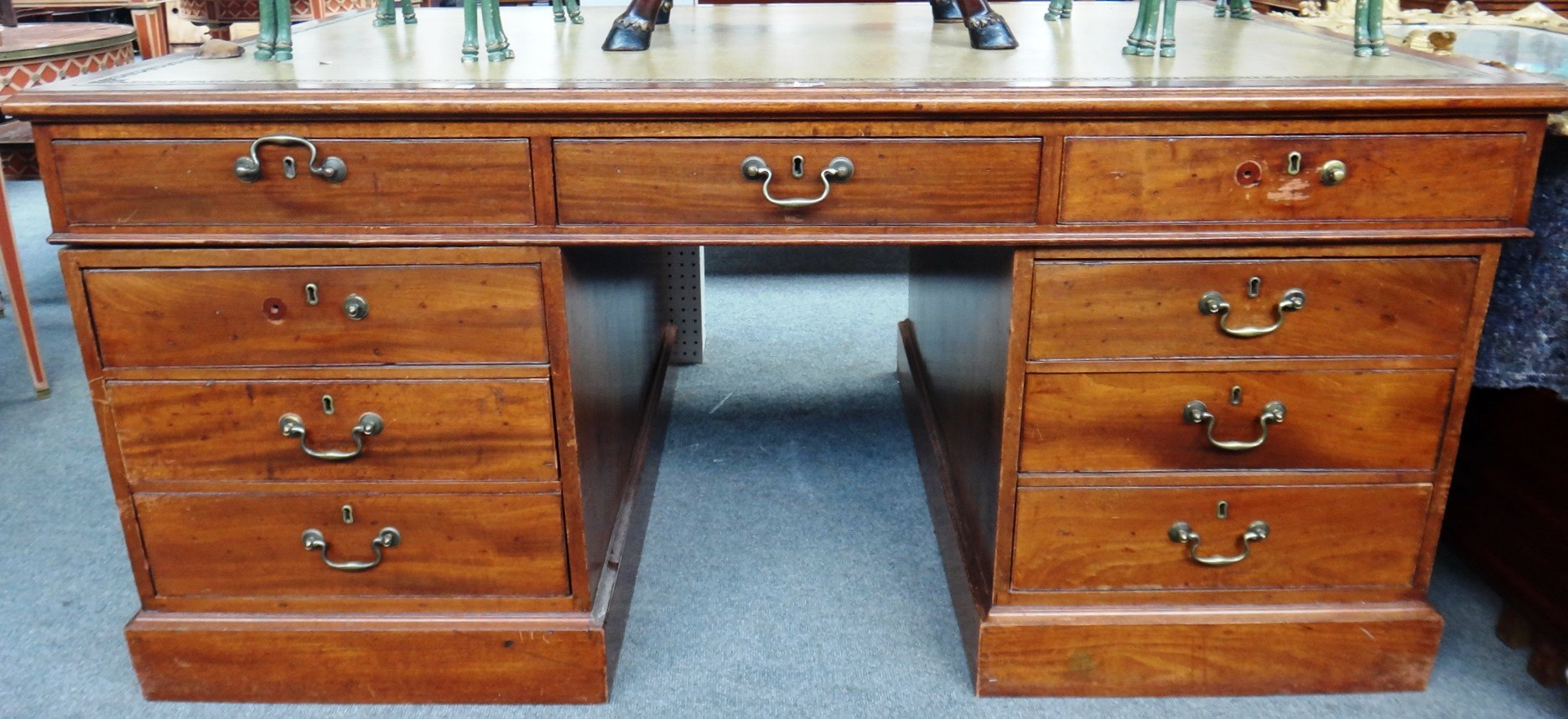 Appraisal: A th century mahogany partners desk with nine drawers about