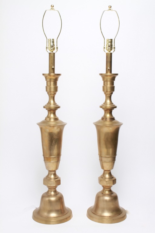 Appraisal: HOLLYWOOD REGENCY TALL BRASS LAMPS PAIR Pair of Hollywood Regency