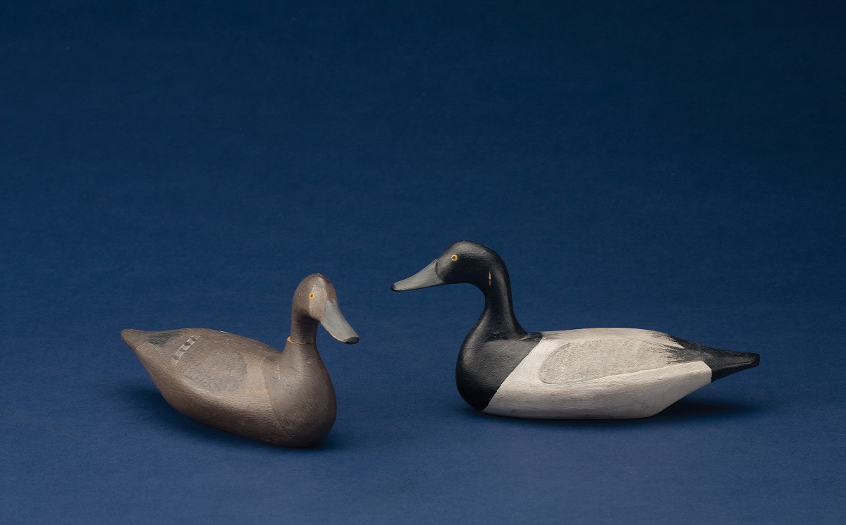 Appraisal: CARVED AND PAINTED MINATURE BLUEBILL DRAKE AND A CANVASBACK HEN