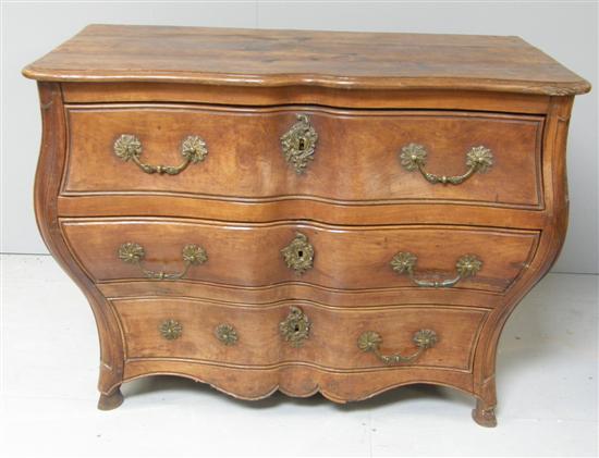 Appraisal: th Century central European walnut bombe commode of three drawers