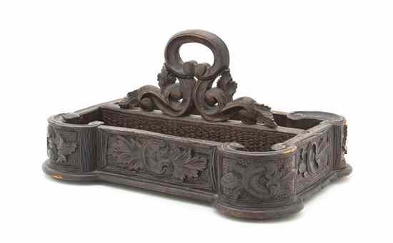 Appraisal: A Continental Carved Pine Letter Rack of rectangular handled form