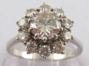 Appraisal: A white metal tests carat gold diamond cluster ring the