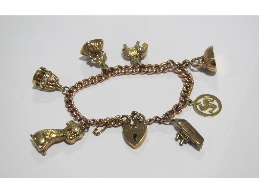 Appraisal: Nine carat gold charm bracelet with seven various ct gold