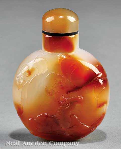 Appraisal: A Chinese Agate Snuff Bottle well hollowed translucent globular body