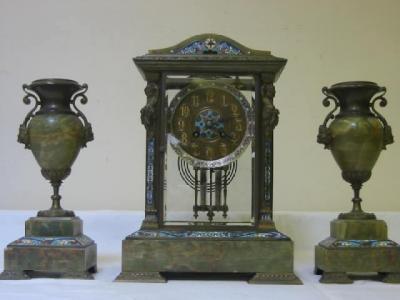 Appraisal: A FRENCH CLOCK GARNITURE the eight day striking movement with