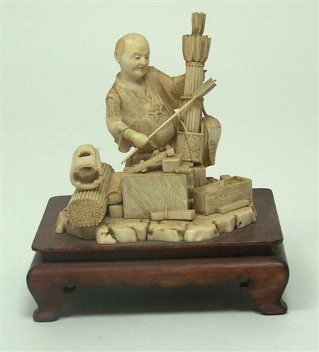 Appraisal: A Japanese ivory figure of an arrow maker Meiji period