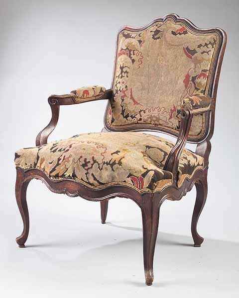 Appraisal: A Louis XV Walnut Fauteuil th c the scalloped molded