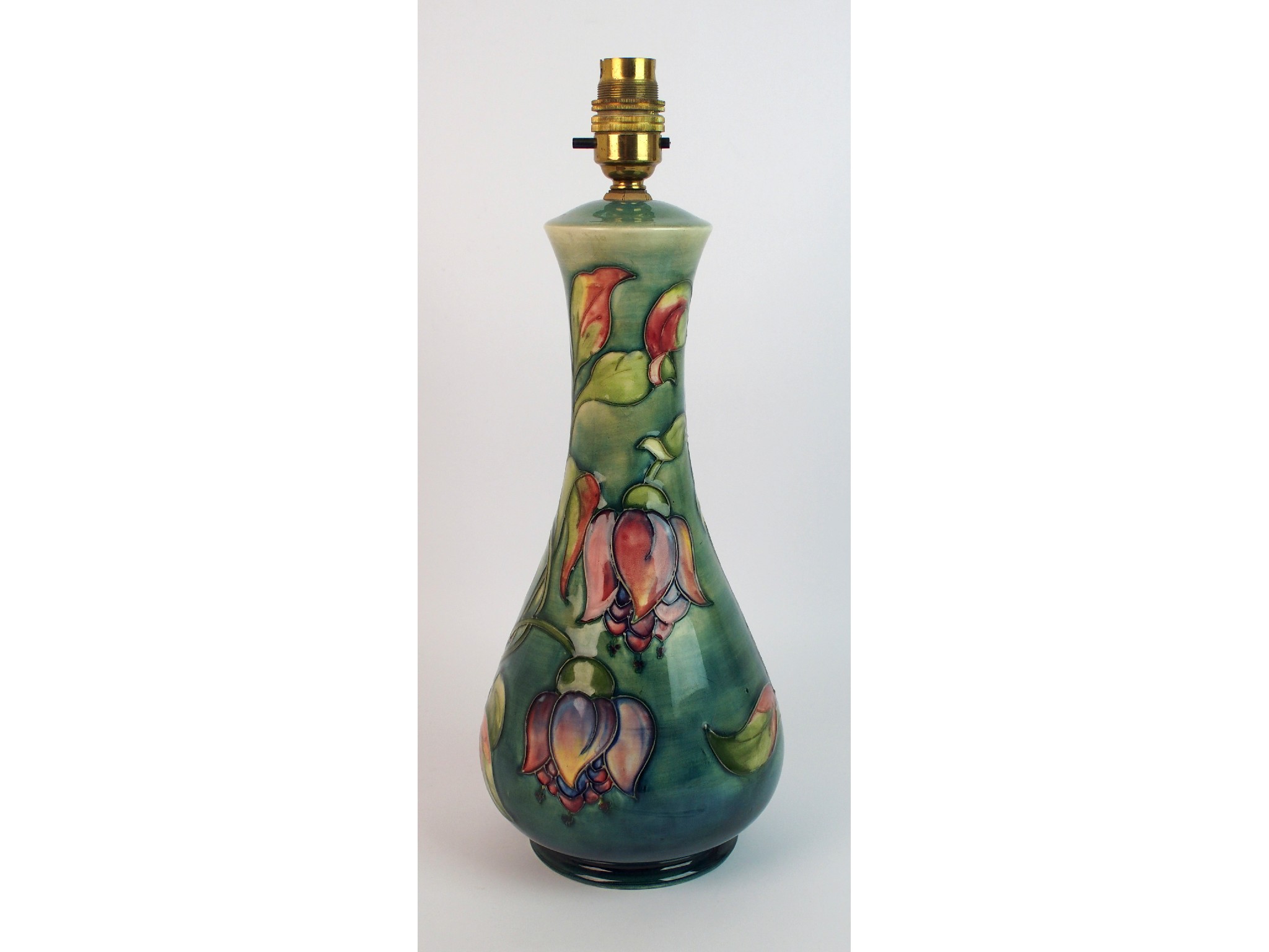 Appraisal: A Moorcroft 'Fuschia' pattern table lampthe pear-shaped body tubelined with