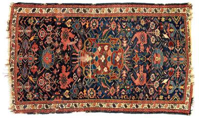 Appraisal: Caucasian rug central medallion on dark blue field floral and