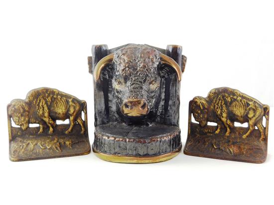 Appraisal: Three th C bull and buffalo themed bookends featuring Dodge