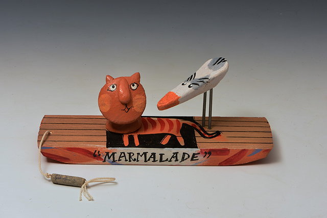 Appraisal: John Maltby British b 'Marmalade' cat on boatwood and ceramicsigned