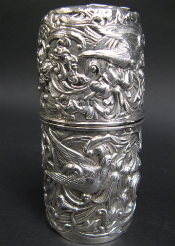 Appraisal: LONDON STERLING SILVER SUGAR SHAKER with all-over repousse bird decoration