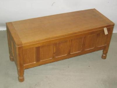 Appraisal: AN ADZED OAK BLANKET BOX by Robert Mouseman Thompson of