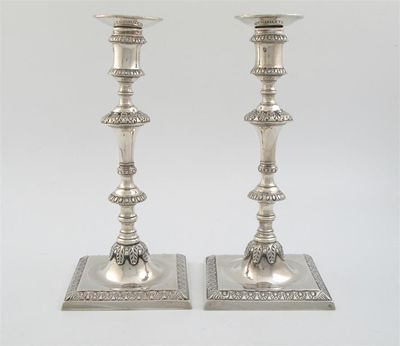 Appraisal: A pair of George III cast candlesticks on square bases