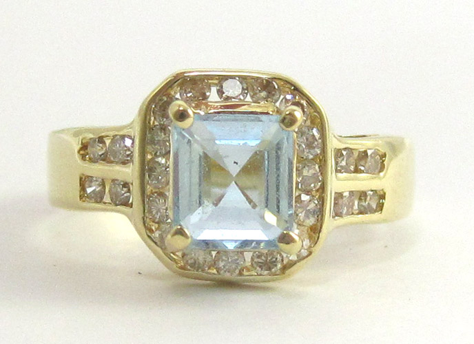 Appraisal: AQUAMARINE AND FOURTEEN YELLOW GOLD RING having round-cut diamonds set