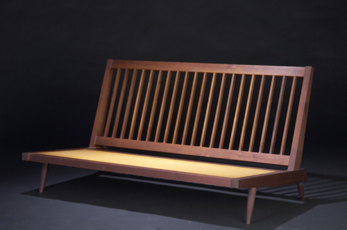 Appraisal: GEORGE NAKASHIMA Walnut settee with fabric upholstered cushions not shown