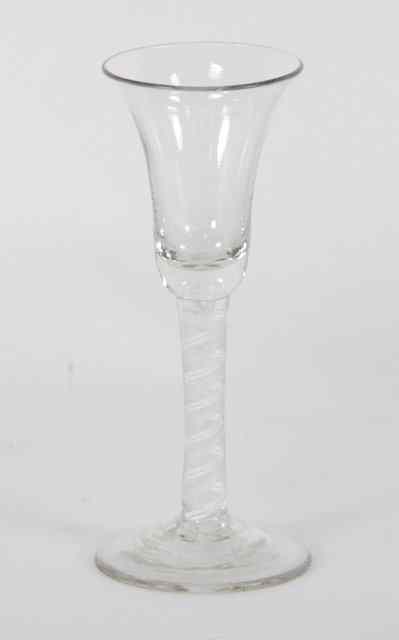 Appraisal: A George III wine glass with opaque and gauze twist