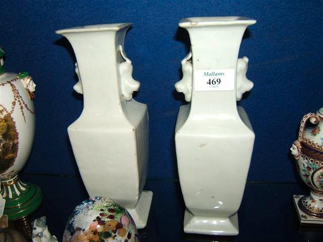 Appraisal: A pair of Chinese blanc de chine vases with dog