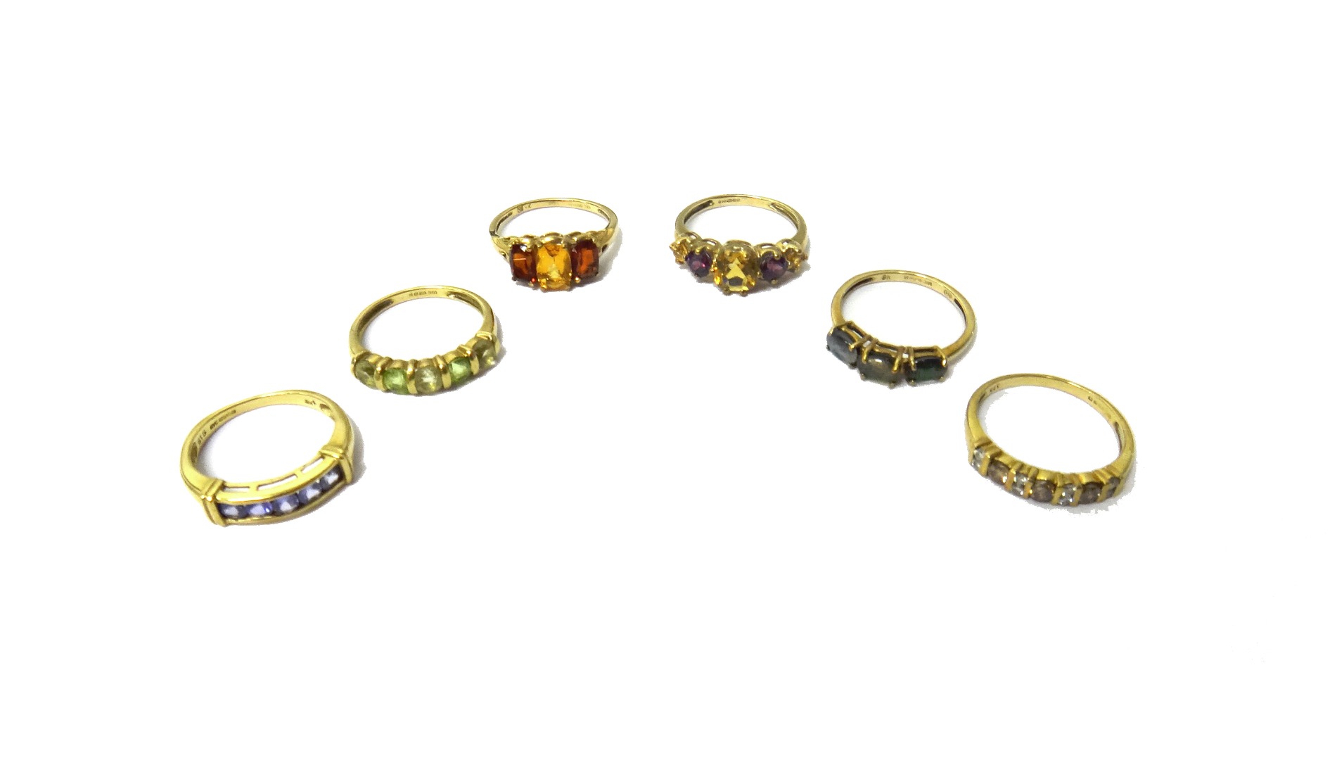 Appraisal: A ct gold garnet and citrine set three stone ring