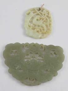 Appraisal: Two Chinese carved jade pendants one as a parrot cm