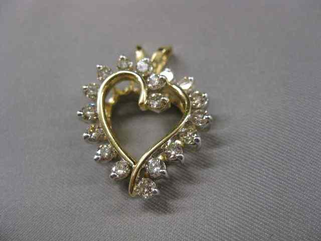 Appraisal: Diamond Heart Pendant round diamonds totaling carat in k yellow