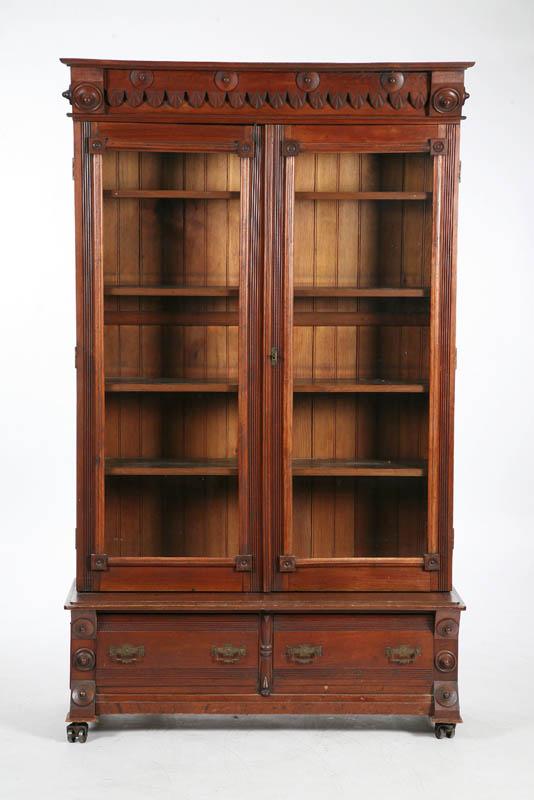 Appraisal: VICTORIAN BOOKCASE Walnut with seashell and incised gallery a molded