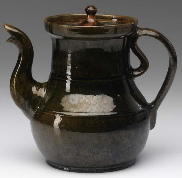 Appraisal: GEORGE OHR Oversized tea pot with an ear-shaped handle and