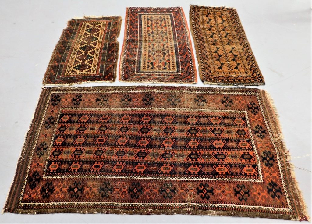 Appraisal: PC GEOMETRIC BALUCH RUGS Middle East th Century Includes a