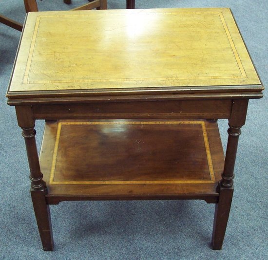 Appraisal: An Edwardian mahogany and satinwood banded card table the foldover